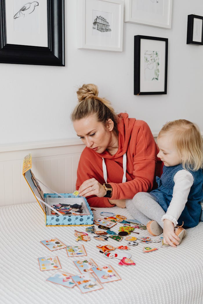 Mother and child enjoying a playful moment with an interactive book indoors.